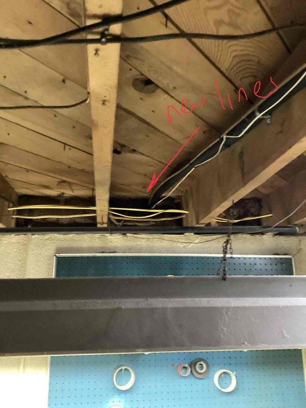 Responded to customer complaint of loud noises from 12-year-old air conditioning system located in basement. Upon inspection, diagnosed system as low on R410A refrigerant and identified oil traces in condensate trap indicating probable evaporator coil leak. Provided replacement estimate for aging AC unit due to refrigerant leak and system age exceeding typical service life.