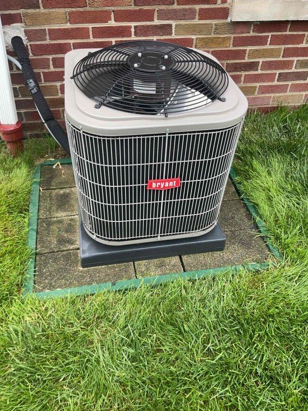Completed comprehensive Gold AC inspection on 7-year-old Bryant air conditioning system with air handler located in basement. Performed thorough examination of outdoor condenser unit, verifying proper operation of compressor, capacitor, and electrical connections. Inspected wiring configuration including multiple conductor connections, refrigerant line fittings, and condenser coil condition. Unit found to be in operational status with all components functioning within normal parameters. Documented equipment condition through photographic records showing clean coil fins, secure electrical connections, and proper installation on concrete pad. System confirmed operational and ready for continued service.