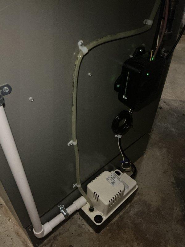 Performed system start-up on newly installed air conditioning equipment with basement-mounted evaporator coil. Verified proper operation of all components including air handler, refrigerant lines, and condensate drainage system with pump. Inspected installation quality, confirmed secure mounting of access panels, checked refrigerant line connections, and tested condensate pump functionality to ensure system is operating within manufacturer specifications.