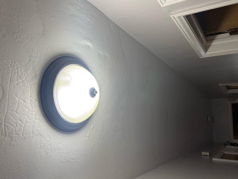 Responded to service call for non-functioning hallway light fixture in upper-floor attic space. Upon inspection, identified issue with circular ceiling-mounted light fixture following recent roof work. Tested electrical connections, verified proper voltage supply, and restored fixture to full operational status. Fixture now illuminating properly with secure mounting and stable electrical connection.