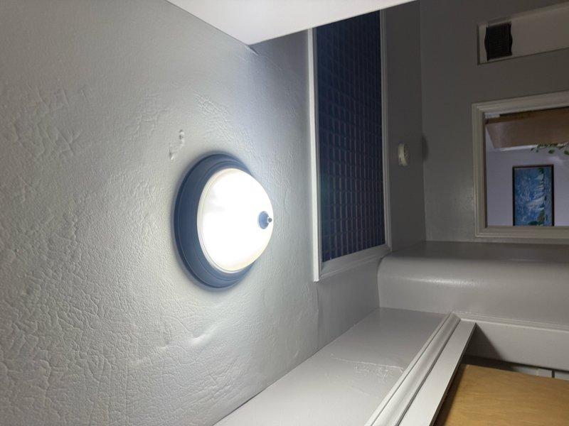 Responded to service call for non-functioning hallway light fixture in upper-floor attic space. Upon inspection, identified issue with circular ceiling-mounted light fixture following recent roof work. Tested electrical connections, verified proper voltage supply, and restored fixture to full operational status. Fixture now illuminating properly with secure mounting and stable electrical connection.