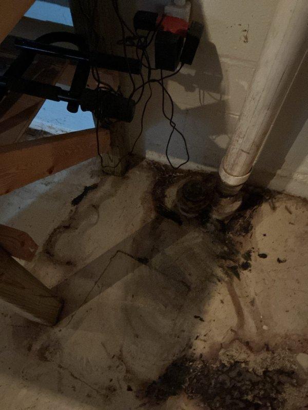 Responded to a drainage issue where utility company was unable to advance camera scope through the sewer line. Upon arrival, found evidence of sewage backup in basement area with significant contamination around floor drain and vertical drain pipe. Performed diagnostic assessment of the blockage preventing scope passage. Documented existing water damage and staining on basement floor surrounding plumbing fixtures, indicating previous or ongoing drainage problems requiring further investigation and remediation.
