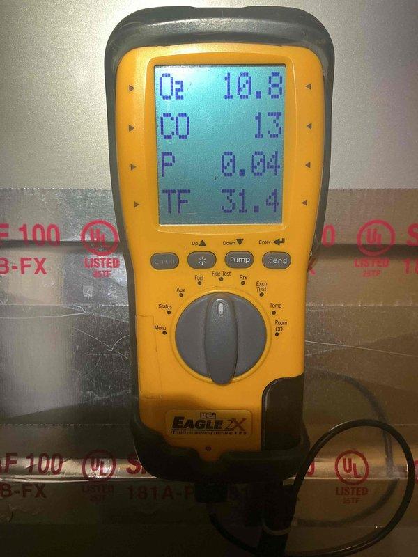 Completed comprehensive heating tune-up on two residential furnaces located in basement, both units less than 10 years old and operational at time of service. Performed combustion analysis testing using digital analyzer, measuring oxygen levels at 10.8%, carbon monoxide at 13 PPM, pressure at 0.04, and flue temperature at 31.4°F. Inspected Bradford White 50-gallon natural gas water heater (Model MI5045GFBM4) and verified proper operation, confirmed all manufacturer labels and safety warnings intact and legible. All equipment found in good working condition with no immediate repairs required.