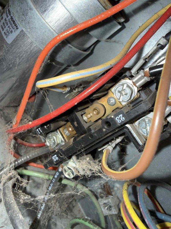 Completed comprehensive Gold AC inspection on 18-year-old residential air conditioning system with basement-located air handler and coil. Performed thorough examination of electrical components, control wiring, and terminal connections, documenting all findings with detailed photography. Utilized digital multimeter to verify electrical readings and test system performance parameters, confirming unit operational status and proper functionality of all components.