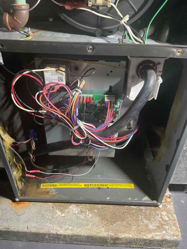 Completed comprehensive city certification inspection on basement-located furnace unit. Performed thorough examination of control board, wiring connections, blower motor assembly, and heat exchanger components with all systems found operational. Inspection included verification of humidifier operation, thermostat functionality, and hot water tank condition per certification requirements.