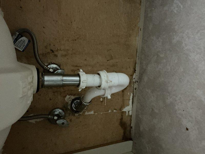Responded to bathroom sink leak occurring during use at single vanity sink location. Upon inspection, identified compromised drain assembly and supply line connections beneath sink causing water seepage when fixture was operated. Disassembled existing drain trap configuration, replaced deteriorated washers and gaskets at connection points, and reinstalled PVC drain assembly with proper sealing. Tightened supply line fittings and verified all connections for proper seal integrity. Tested fixture under normal operating conditions to confirm leak elimination and proper drainage function.
