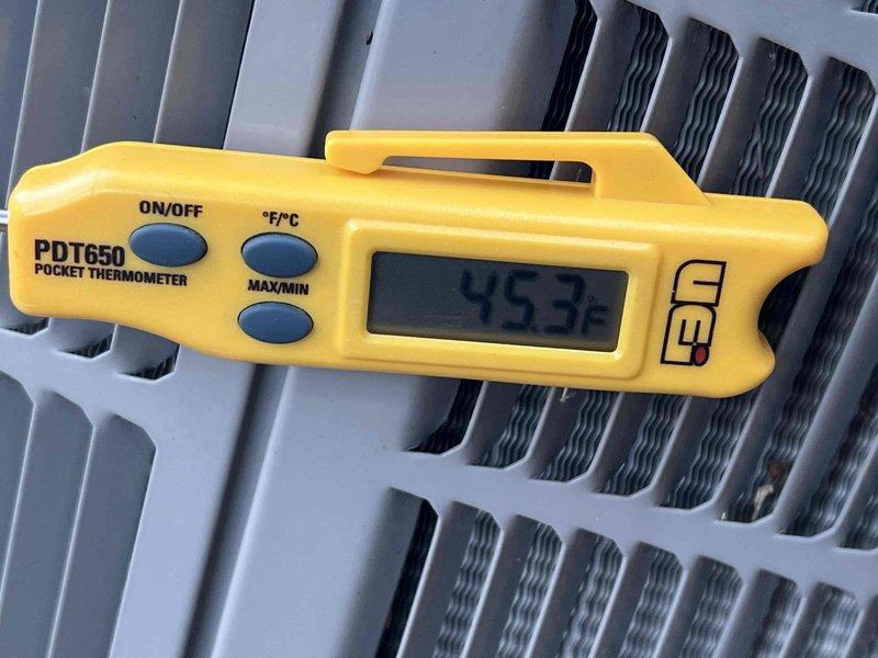 Completed comprehensive Gold AC inspection on 12-year-old single-zone air conditioning system with basement-located air handler. System was operational at time of service. Performed full diagnostic evaluation using digital instrumentation to verify proper system performance. Measured supply air temperature at 45.3°F at register, confirming adequate cooling output. Conducted refrigerant system analysis using manifold gauges, recording system pressures of -61.4 PSIG on both high and low sides for R410A refrigerant. Documented temperature differentials with return dry bulb at 70.3°F, return wet bulb at 56.9°F, supply dry bulb at 44.4°F, and supply wet bulb at 41.4°F, indicating proper heat exchange and dehumidification. All measurements fall within acceptable operating parameters for residential cooling equipment. System demonstrated normal operation with no deficiencies identified during inspection.