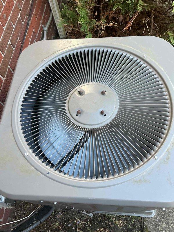 Completed comprehensive Gold AC inspection on a 10+ year old Lennox 13ACX-036-230-17 outdoor condensing unit utilizing HFC-410A refrigerant. Unit was operational upon arrival with system located at outdoor/basement configuration. Performed thorough visual assessment of condenser exterior housing, verified fan grille condition and proper mounting, inspected refrigerant line sets and electrical conduit connections. Confirmed manufacturer specifications including 208/230V electrical supply, design pressures of 446 PSIG high side and 236 PSIG low side, factory refrigerant charge of 5 lbs 4 oz, compressor RLA of 16.7 and condenser fan motor specifications of 1/5 HP. Documented unit serial number 1913D25655 and overall equipment condition showing typical outdoor weathering with functional operation maintained throughout inspection.