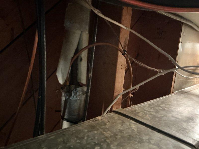 Completed comprehensive Gold AC inspection on 10+ year old system with components located in basement and exterior. Inspected furnace, air handler, humidifier unit, ductwork, and copper refrigerant lines throughout mechanical space. Verified proper operation of all HVAC components, checked insulated ductwork integrity, examined flexible duct connections, and assessed humidifier integration with main system. All equipment found operational with normal age-related wear patterns documented through photographic evidence.