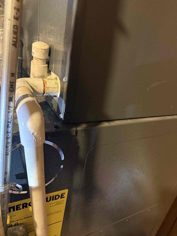 Completed routine maintenance and inspection on 10+ year old residential air conditioning system. Performed visual inspection of outdoor condenser unit, confirming proper external condition with no significant damage or deterioration to housing and heat exchanger fins. Inspected indoor basement coil location and associated condensate drainage system with PVC piping and connections. Unit confirmed operational at time of service with all components functioning as designed.