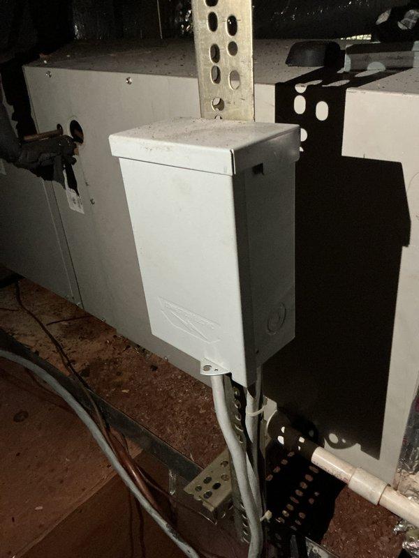 Completed estimate for air conditioning system replacement in attic location. Existing 10+ year old unit is non-operational and requires full replacement. Documented extensively damaged ductwork insulation with multiple tears, separations, and deteriorated foil facing throughout visible sections, along with existing electrical components and control units mounted on attic structural beams. Natural gas furnace remains in place with AC replacement recommended.