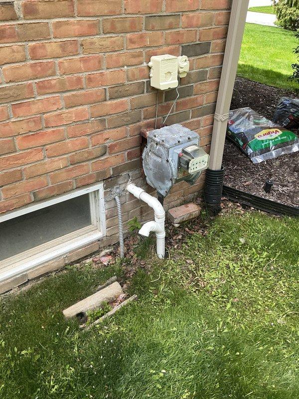 Coordinated with municipal water department for scheduled water shut-off and completed on-site installation and repair work involving backflow preventer, plumbing connections, and sump pump system. Plumber maintained required presence during city water department operations to ensure compliance with municipal regulations. All components were properly installed, tested, and documented with photographic records of the backflow preventer assembly and exterior plumbing installations at the property foundation area.