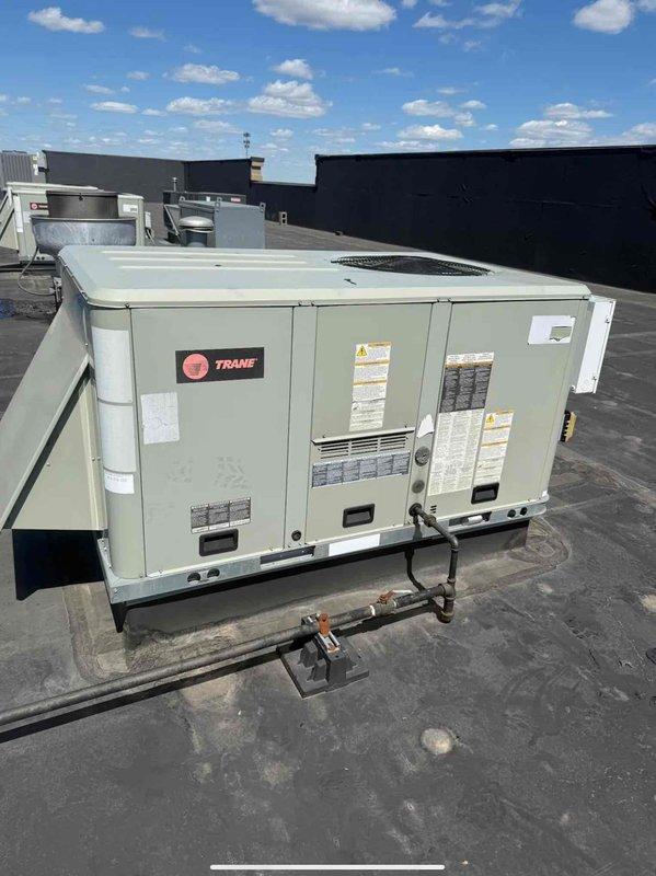 Completed scheduled commercial HVAC maintenance agreement service on two Trane packaged rooftop units. Performed comprehensive preventive maintenance inspections on both systems, including operational testing with diagnostic gauges to verify refrigerant pressures and system performance, visual inspection of electrical components and controls, examination of unit mounting and vibration dampening pads, and documentation of equipment condition through photographic records for maintenance history files.