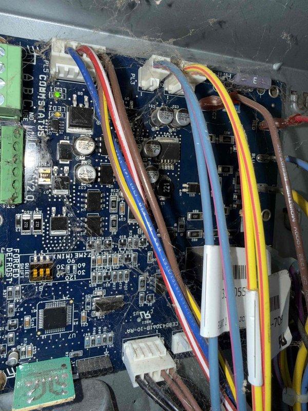 Completed annual preventive maintenance on 10-year-old air conditioning system with components in basement and backyard. Inspected and tested electronic control board assembly, verifying proper operation of circuit boards, connections, and wiring harnesses. Measured system temperatures using digital thermometer, recording 73.3°F at test point. Cleaned accumulated dust and debris from control panel enclosure and surrounding areas. All electrical connections secure, control boards functioning within normal parameters, and system operating efficiently with no deficiencies noted.