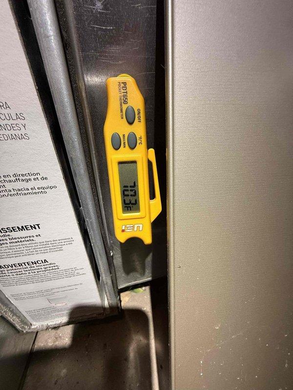 Completed annual preventive maintenance on 10-year-old air conditioning system with components in basement and backyard. Inspected and tested electronic control board assembly, verifying proper operation of circuit boards, connections, and wiring harnesses. Measured system temperatures using digital thermometer, recording 73.3°F at test point. Cleaned accumulated dust and debris from control panel enclosure and surrounding areas. All electrical connections secure, control boards functioning within normal parameters, and system operating efficiently with no deficiencies noted.