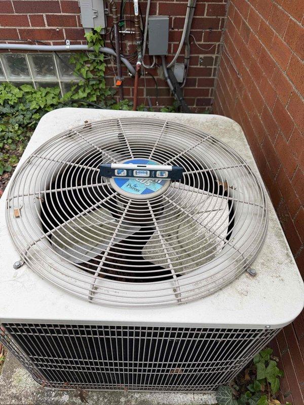 Completed comprehensive tune-up on 20-year-old residential air conditioning system with outdoor condenser unit located at basement level. Performed full system inspection including examination of condenser unit exterior, fan assembly operation, refrigerant line connections, and electrical disconnect components. Inspected control board and electrical connections, verified proper wiring terminations at terminal blocks, and assessed capacitor and relay functionality to ensure optimal system performance for the cooling season.