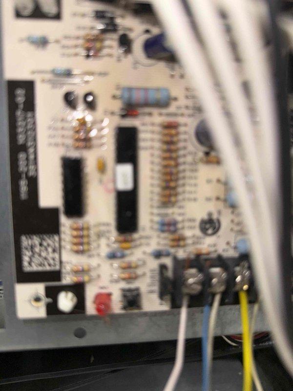 Completed comprehensive tune-up on 20-year-old residential air conditioning system with outdoor condenser unit located at basement level. Performed full system inspection including examination of condenser unit exterior, fan assembly operation, refrigerant line connections, and electrical disconnect components. Inspected control board and electrical connections, verified proper wiring terminations at terminal blocks, and assessed capacitor and relay functionality to ensure optimal system performance for the cooling season.