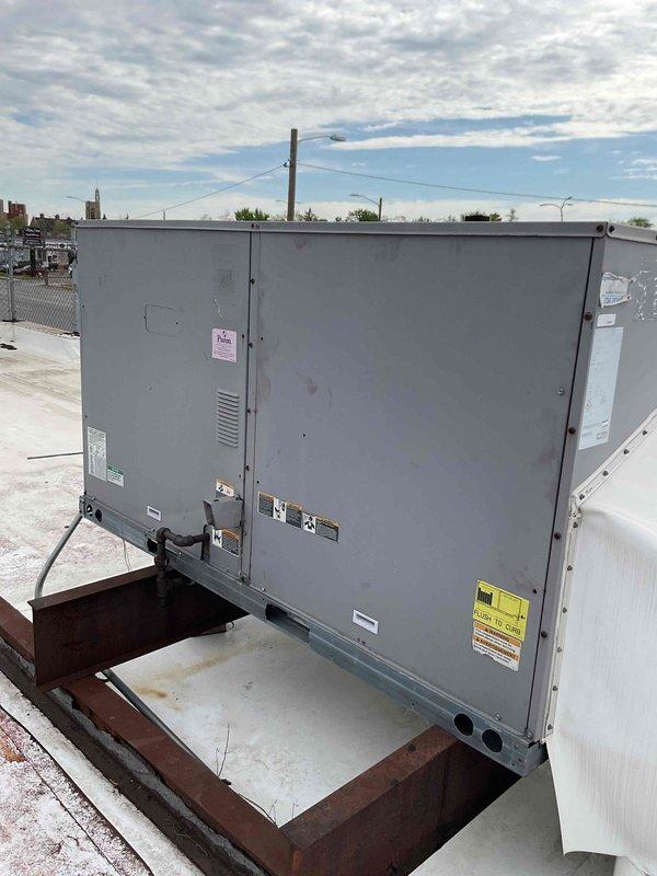 Completed commercial HVAC maintenance agreement service on two rooftop units, including filter replacement with materials picked up from supply house under specified purchase order. Performed comprehensive inspection of RTU components including blower motor assembly, belt drive system, and fan wheel operation, documenting equipment condition with photos. Renewed commercial maintenance agreement on-site per customer request.