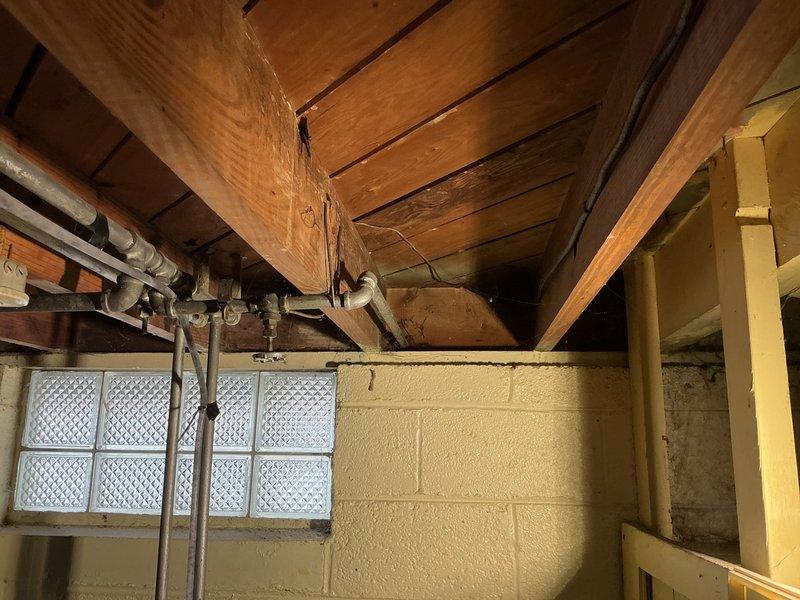 Installed new frost-free hose bib in basement utility area, routing supply line through ceiling joists and securing with appropriate mounting brackets. Exterior hose bib was mounted to galvanized fence post with concrete base, ensuring proper drainage angle and secure attachment for year-round outdoor water access.
