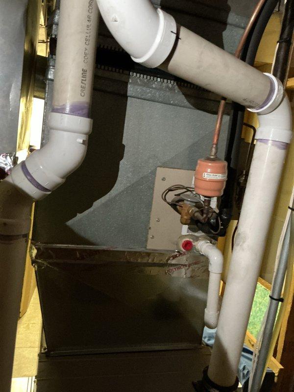 Provided estimate for complete air conditioning system replacement including outdoor condensing unit and indoor evaporator coil located in basement. Existing 10+ year old unit had failed the previous year with repair costs approaching replacement value and was currently non-operational. System assessment included evaluation of natural gas furnace compatibility, existing PVC condensate drainage configuration, and thermostat replacement requirements to ensure proper integration with new equipment.