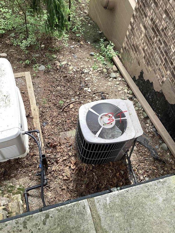 Provided estimates for replacement of two air conditioning systems serving a multi-level residence with basement-located furnaces. AC unit #2 (upstairs zone) diagnosed with airflow restrictions, refrigerant system restriction, and outdoor fan motor drawing excessive amperage at 55°F outdoor temperature, indicating potential compressor failure risk in warmer conditions. AC unit #1 experiencing inadequate airflow causing evaporator coil freezing. Both systems, over 10 years old, found with degraded capacitors affecting performance and reliability.