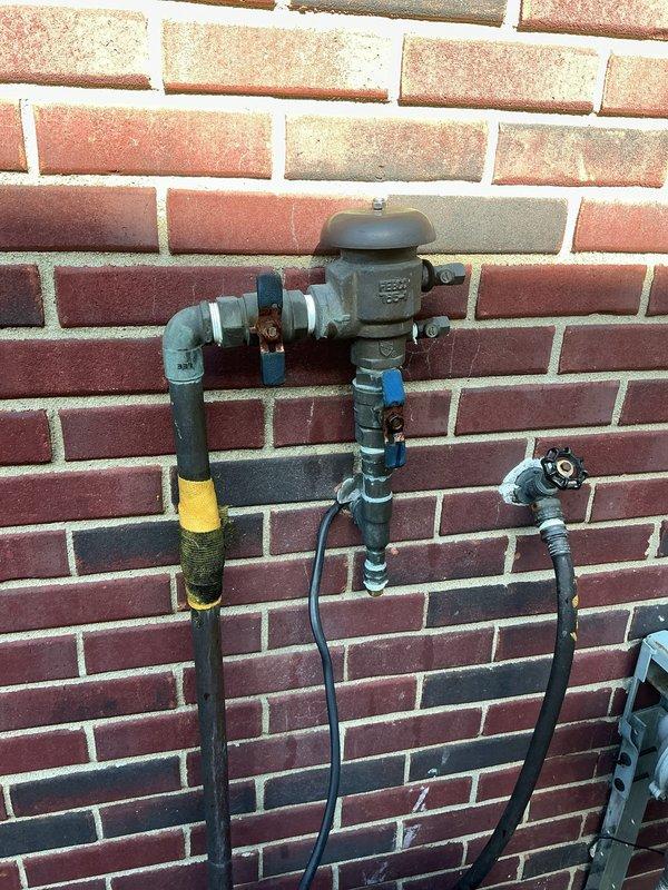 Completed annual sprinkler backflow testing and water treatment maintenance for municipal compliance certification. Performed comprehensive inspection and testing of backflow prevention device, verified proper operation of all valves and connections, and documented results with photographic evidence of gas meter assembly and exterior plumbing components. All systems tested within acceptable parameters and certification documentation prepared for submission to municipal authorities.