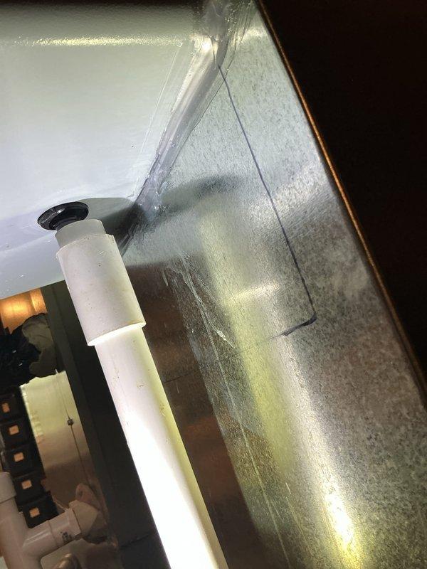 Responded to mechanical violation notice by addressing two warranty issues on recently installed HVAC system. Resealed the bottom of the humidifier unit to eliminate potential moisture intrusion points. Resolved condensate leak occurring inside the furnace cabinet by inspecting drain pan integrity, verifying proper drainage flow through PVC condensate lines, and ensuring all connections were secure and properly sealed to prevent future water accumulation.