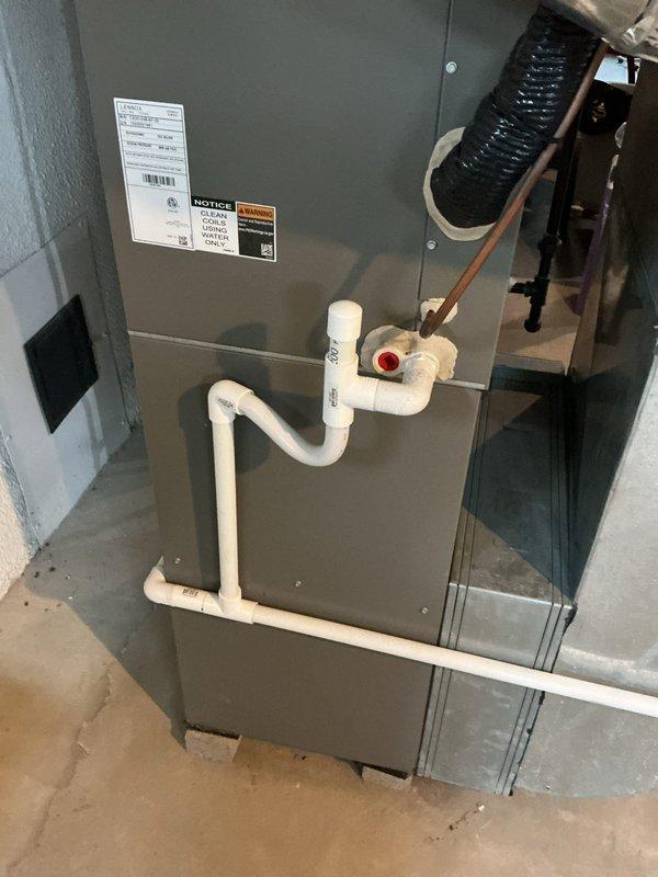 Completed NSP AC inspection on 3-year-old system located in basement. Inspected Lennox air handler and associated HVAC equipment, verified proper operation of all components. Checked refrigerant lines, condensate drainage system with PVC trap configuration, and all electrical connections. Unit found in good operating condition with no immediate concerns noted. All safety labels present and legible. System operating within normal parameters.