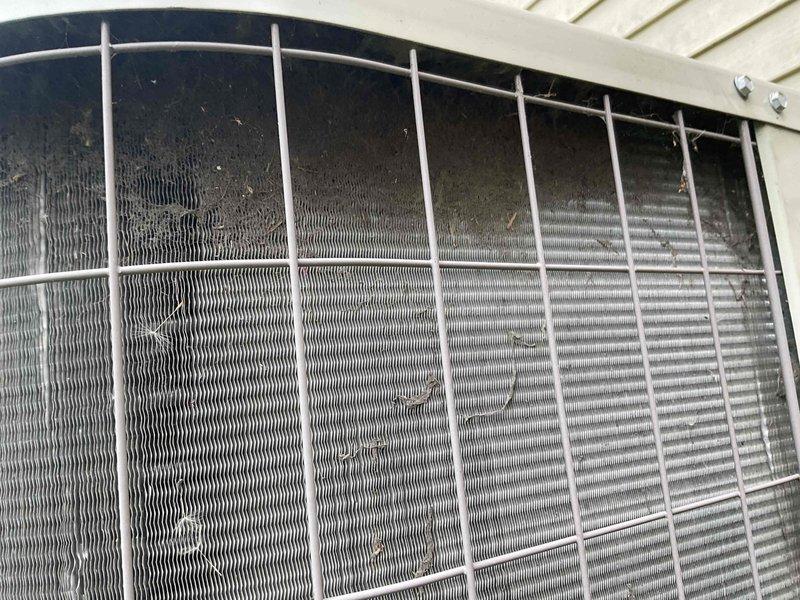 Completed Gold AC inspection on a single 2021 outdoor condensing unit with air handler located in basement. Unit operational at time of inspection. Observed moderate debris accumulation on condenser coil fins, particularly in upper sections, with environmental dust and lint buildup noted during visual assessment. Exterior cabinet and protective wire grilles in good condition with no visible damage to housing or components. Homeowner advised that uninterruptible service option was affected by recent DTE furnace installation and expressed interest in exploring restoration options for this service feature.