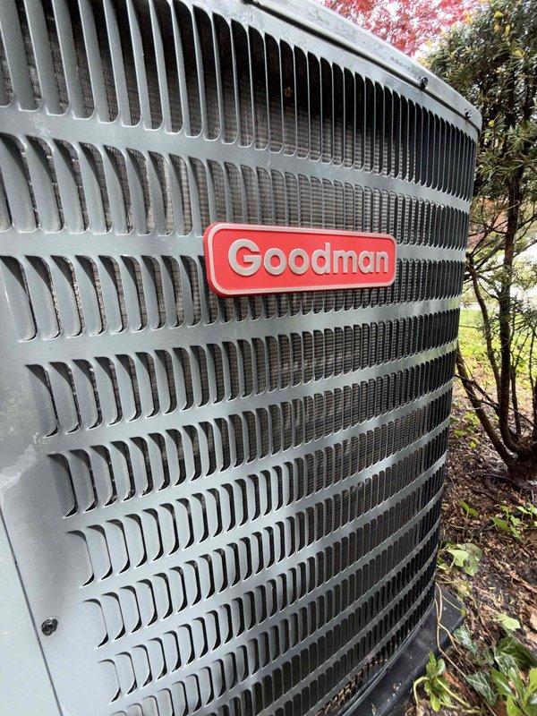 Completed comprehensive Gold AC inspection on 10-year-old Goodman air conditioning system. Performed thorough evaluation of outdoor condensing unit, confirming proper operation and assessing overall system condition. Inspected condenser cabinet, louvered fins, and external components for signs of wear, damage, or deterioration. Verified electrical connections and refrigerant lines running from building to condensing unit. Examined air handler/coil assembly located in basement. Assessed installation area, noting adequate clearance around outdoor unit and proper drainage line configuration. Confirmed system is functioning as designed with no immediate service needs identified. All components inspected and found to be in satisfactory operating condition for equipment age.