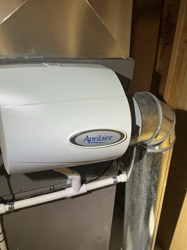 Completed AC system start-up procedures for residential HVAC installation in basement mechanical room. Performed operational testing and verification of Evcon furnace unit with integrated Aprilaire whole-home humidifier system. Confirmed proper function of all components including venting configuration, ductwork connections, and humidifier water supply lines. System commissioned and running to manufacturer specifications.