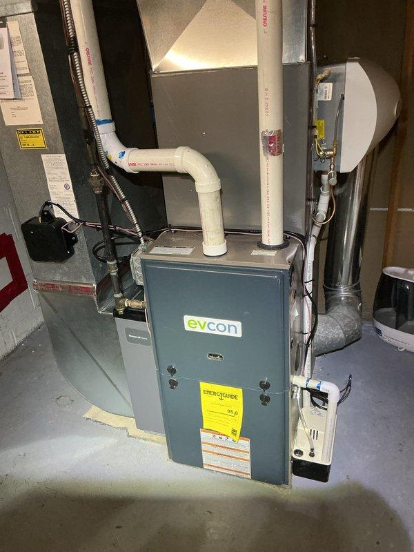 Completed AC system start-up procedures for residential HVAC installation in basement mechanical room. Performed operational testing and verification of Evcon furnace unit with integrated Aprilaire whole-home humidifier system. Confirmed proper function of all components including venting configuration, ductwork connections, and humidifier water supply lines. System commissioned and running to manufacturer specifications.