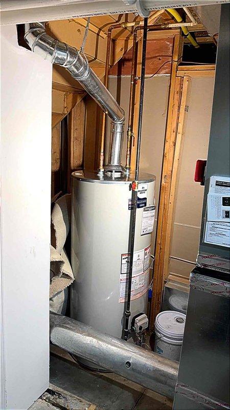 Installed and reconnected a 75-gallon tanked water heater in the utility room, completing all plumbing connections with copper piping and properly venting the unit through the existing exhaust system. Floor protection was utilized throughout the work area to prevent damage to hardwood flooring during the installation process. All manufacturer specifications were followed, connections were tested for proper operation, and the unit was commissioned successfully.
