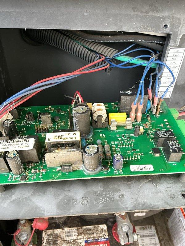 Responded to service call for a 15kW Briggs and Stratton generator that would not shut off properly. Performed diagnostic evaluation of the automatic transfer switch and generator control system. Inspected the control board, transfer switch contactors, and associated wiring connections within the transfer switch panel. Identified issue with the generator control circuit preventing proper shutdown sequence. Tested relay operation and control board functionality to isolate the malfunction. Documented existing conditions of the transfer switch panel and control board assembly with photos showing wiring configuration, contactor arrangement, and control board components for service records and potential parts ordering.
