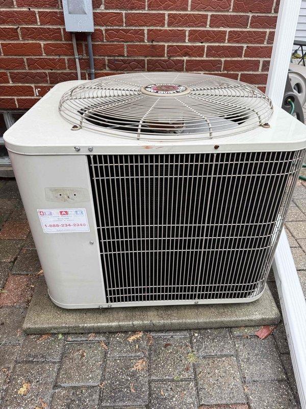 Completed spring air conditioning tune-up and inspection on 25-year-old outdoor condensing unit. Performed comprehensive maintenance including visual inspection of cabinet, condenser coils, fan assembly, and electrical components. Unit found in operational condition with no visible damage, deterioration, or immediate service concerns noted. Documented equipment condition with photographs for service records.