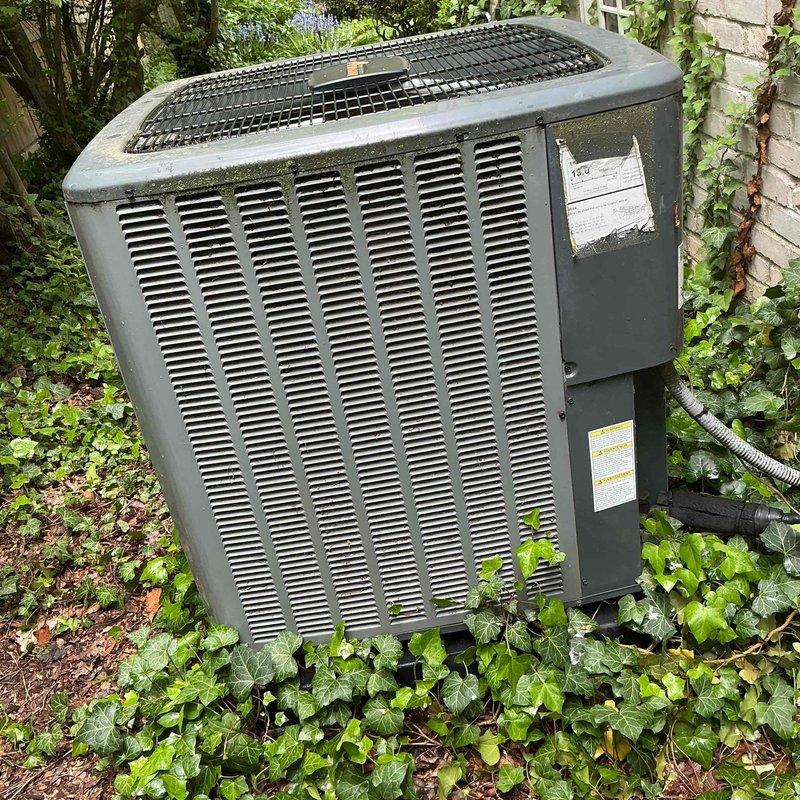 Responded to service call for central air conditioning system not cooling at full strength. Upon inspection, accessed electrical control panel and evaluated capacitors, wiring connections, and CoreSense diagnostic module for proper operation. Examined outdoor condenser unit positioned in landscaped area, checking for airflow obstructions, refrigerant levels, and overall system performance to diagnose reduced cooling capacity and restore unit to optimal operating condition.