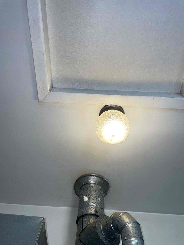 Completed comprehensive estimate for replacement of aging HVAC system and water heater, with water heater exhibiting black substance discharge indicating potential sediment buildup or tank deterioration. Documented existing electrical infrastructure in attic space, including breaker panel configuration and gas piping assembly, to assess compatibility requirements for new equipment installation.
