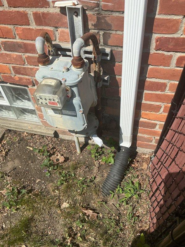 Responded to service call for gas line installation in basement laundry room to accommodate new dryer in 50-year-old residence. Upon arrival, inspected existing gas infrastructure and confirmed no active leaks or gas odors present. Reviewed manufacturer's installation specifications for new dryer unit, which required proper gas supply line connection with manual shutoff valve per National Fuel Gas Code ANSI Z223.1 standards.

Installed new gas supply line using flexible stainless steel gas connector with appropriate pipe sizing (1/2" IPS with 3/8" specifications) to ensure safe and code-compliant connection between existing gas system and dryer location. Installed manual shutoff valve within required distance from appliance for emergency accessibility. Verified all connections were properly tightened and sealed to manufacturer specifications.

Conducted thorough pressure testing of new gas line installation to confirm system integrity and absence of leaks. Inspected exterior gas meter 