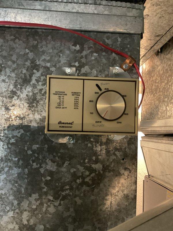 Completed comprehensive Gold AC Inspection on two residential HVAC units, both approximately 6 years old, with air handler and coil located in basement. Performed standard maintenance protocol including inspection of humidistat control mounted on ductwork, verified proper humidity settings ranging from 25% to 35% based on outdoor temperature conditions, and examined electrical control panel with input power switch and coil energization indicators. All systems operational with no service issues identified at time of inspection.
