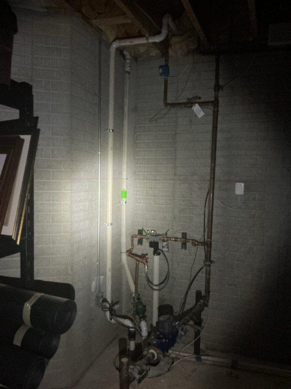 Conducted on-site evaluation of existing plumbing infrastructure in basement utility area to provide estimate for backflow preventer installation as required by City of Birmingham code compliance. Assessed current water supply piping configuration, including copper and PVC lines, to determine optimal placement and connection points for backflow prevention device that meets municipal specifications.