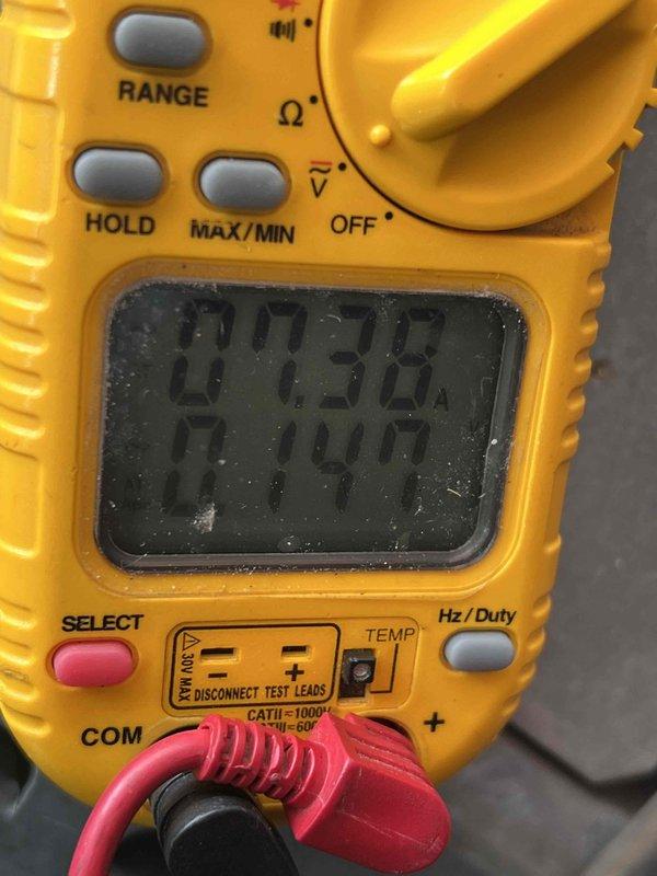 Completed comprehensive tune-up on 17-year-old HVAC system located in utility area. Performed full inspection including thermostat calibration, humidifier check, and hot water tank evaluation. Tested and verified run capacitor (40/5 µF) using digital multimeter to ensure proper electrical performance and system efficiency. Customer renewed maintenance plan onsite following inspection. Documented all findings with photos for service records.