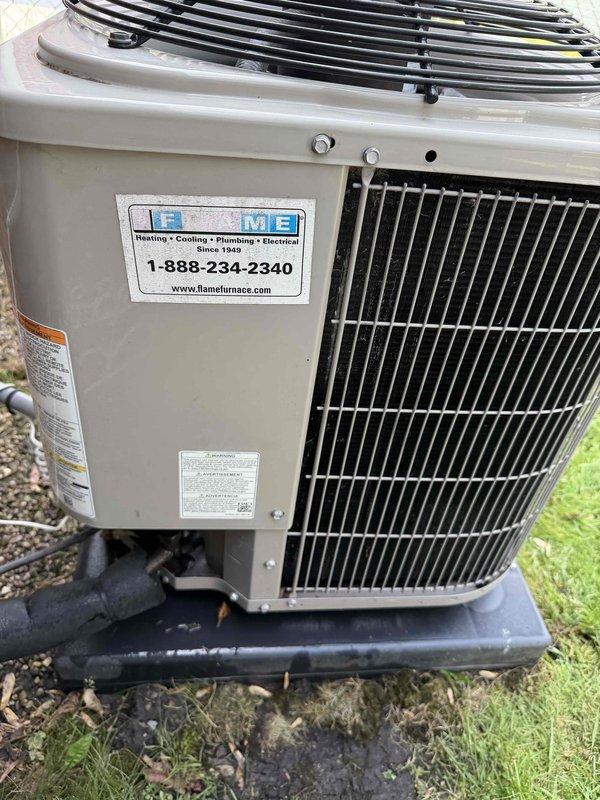 Completed comprehensive Gold AC Inspection on residential air conditioning system. Performed full system diagnostics using calibrated testing equipment to measure refrigerant levels, electrical performance, and overall unit operation. Documented unit condition with detailed photography showing Flame Furnace-serviced condenser unit in good working order with normal seasonal wear, proper installation on pad, and secure refrigerant line connections.