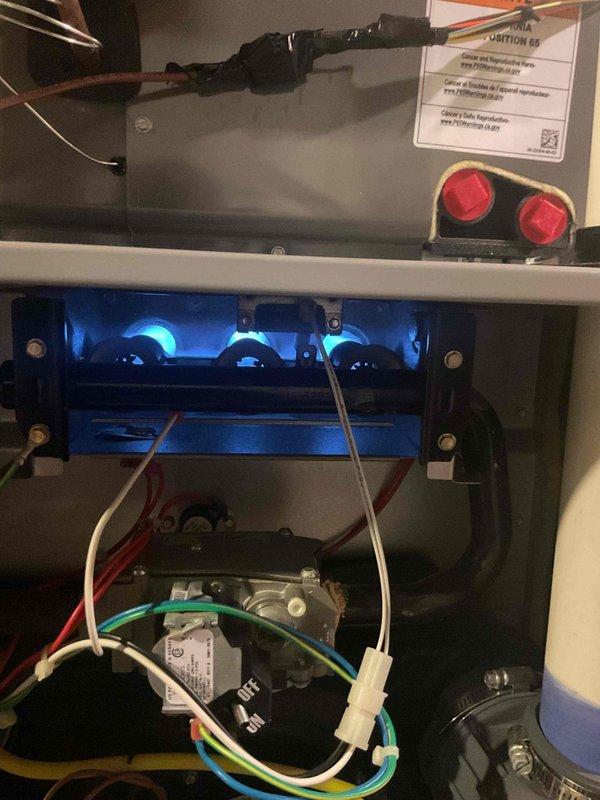 Responded to no-heat call with thermostat set at 66°F and interior temperature at 64°F. Upon inspection, found furnace burners not igniting during call for heat. Accessed unit interior, inspected gas valve, ignition system, and electrical connections. Identified ignition failure and performed necessary diagnostics on flame sensor and hot surface ignitor. Restored system to proper operation with burners firing correctly, verified blue flame pattern across all burner ports, and confirmed unit cycling properly through complete heating cycle.