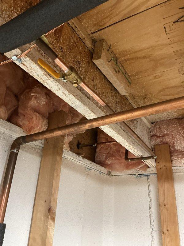 Installed one exterior hose bib and three interior faucets in residential property. Routed new copper supply lines through floor joists in crawl space, utilizing proper pipe hangers and supports, with soldered connections at all fittings to ensure leak-free operation and code compliance.