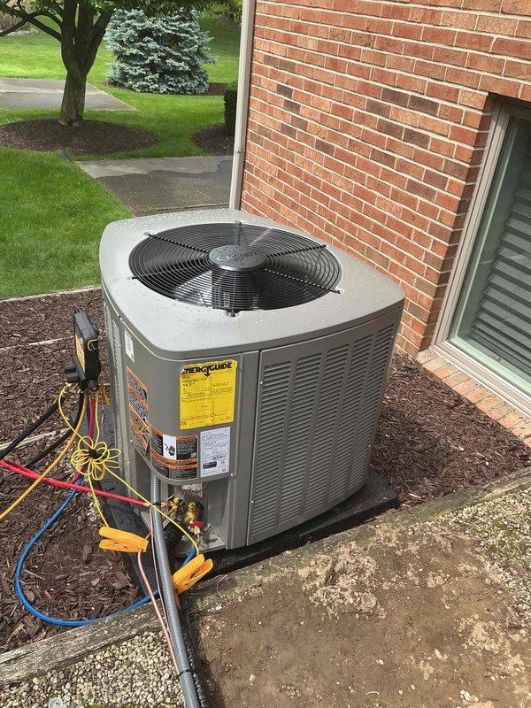 Completed installation of 4-ton air conditioning system with matching evaporator coil at rear of residence. Positioned new condensing unit on concrete pad, established refrigerant connections, performed system startup and diagnostics using manifold gauges to verify proper refrigerant charge and operating pressures. All components tested and operational, with mechanical permit requested for compliance documentation.