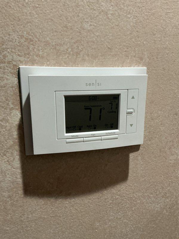 Completed comprehensive Gold AC inspection on Bryant HVAC system with air handler located in basement. Unit is under 10 years old and operating properly with Sensi thermostat displaying 71 degrees in cooling mode. Advised customer to maintain clear area around outdoor condenser unit, removing any debris and animal waste for optimal system performance.