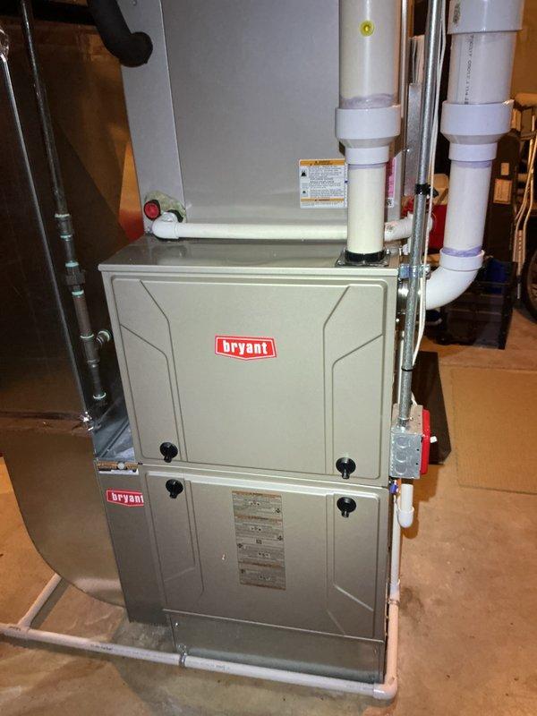 Completed comprehensive Gold AC inspection on Bryant HVAC system with air handler located in basement. Unit is under 10 years old and operating properly with Sensi thermostat displaying 71 degrees in cooling mode. Advised customer to maintain clear area around outdoor condenser unit, removing any debris and animal waste for optimal system performance.