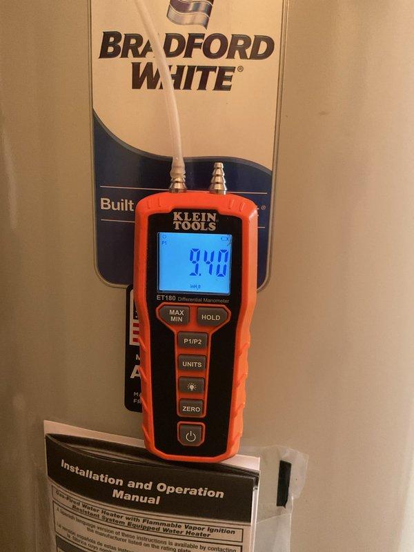 Completed full HVAC system installation including 70,000 BTU furnace with humidifier, 2-ton rear-discharge air conditioning unit, and 50-gallon Bradford White gas water heater. Ran new gas piping to all appliances and verified proper pressure readings at 9.40 inH2O. Installed thermostat and performed electrical connections at main panel. Obtained mechanical and electrical permits. System tested and operational, with DTE and SEMCO rebate documentation submitted under AHRI certificate 215566314.