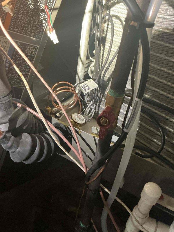 Completed Gold AC inspection on a single-zone mini-split system with the air handler located in the crawlspace. Inspected outdoor condenser unit, verifying fan operation, protective guard integrity, and overall unit condition on concrete pad. Examined indoor air handler and associated components in crawlspace, including refrigerant line sets, condensate drain piping, electrical connections, control board, and ductwork connections. All components found to be in good working order with system operating normally. Equipment is nearly new (2026 model year) and shows no signs of wear or operational concerns. System confirmed to be functioning properly at time of inspection.
