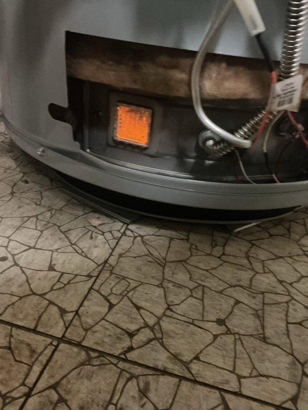 Responded to service call for failed residential water heater. Upon arrival, assessed existing tanked water heater unit located in basement mechanical room. Unit exhibited complete failure with no hot water production. Confirmed pilot light was extinguished and burner assembly was non-operational. 

Inspected existing venting system consisting of metallic ductwork with proper draft configuration and insulated sections. Verified all plumbing connections including supply and discharge lines were intact. Evaluated electrical connections and gas supply lines for proper function and safety compliance.

Performed diagnostic testing on thermocouple, gas valve, and ignition system. Determined water heater had reached end of serviceable life and required full replacement. Proceeded with complete water heater removal and installation of new unit. Reconnected all existing plumbing infrastructure, gas supply line, and venting system to manufacturer specifications. Tested pilot ignition, burner ope